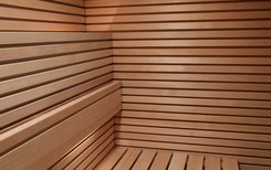 PURE sauna: Real wood veneer panels with horizontally applied bars of solid hemlock.