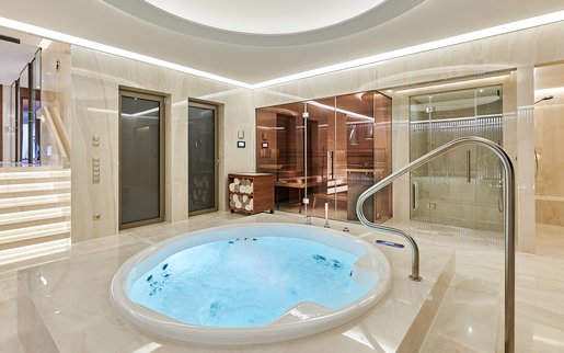 Private wellness area with jacuzzi, sauna and steam bath.